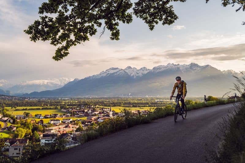 Cycling in Liechtenstein with view of the Alps